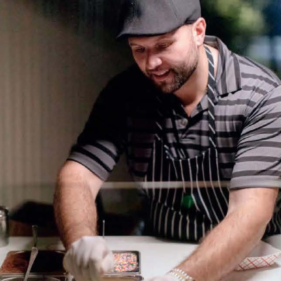 Nick D'Anna making cannoli's in his shop. 