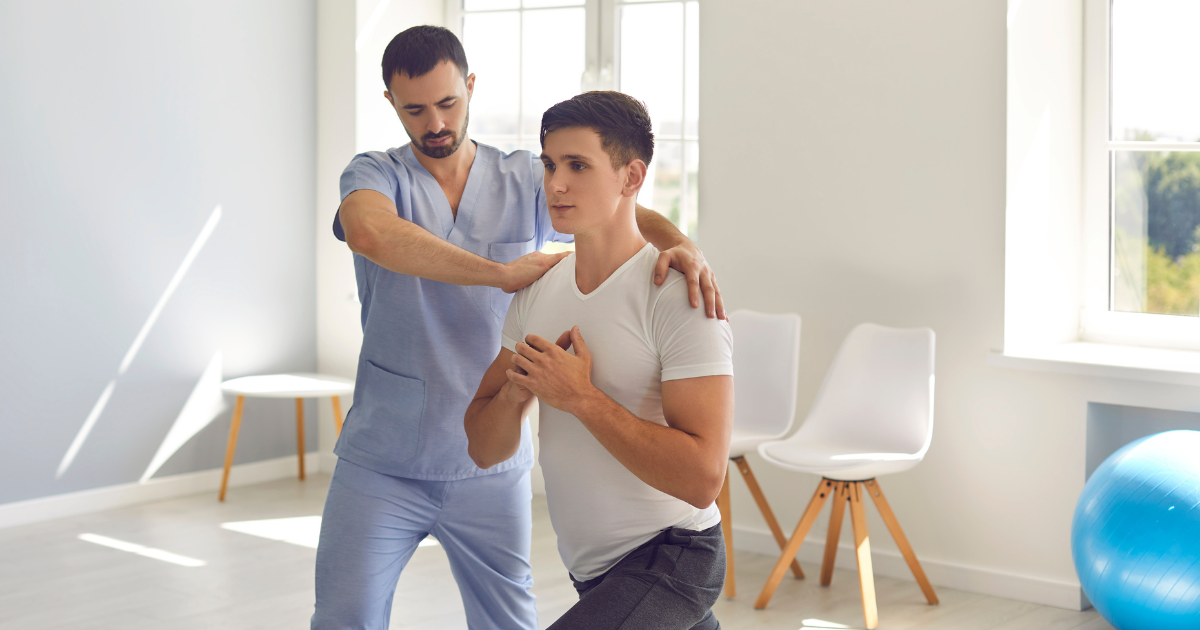A physical therapist is helping a patient keep his balance while lunging. 