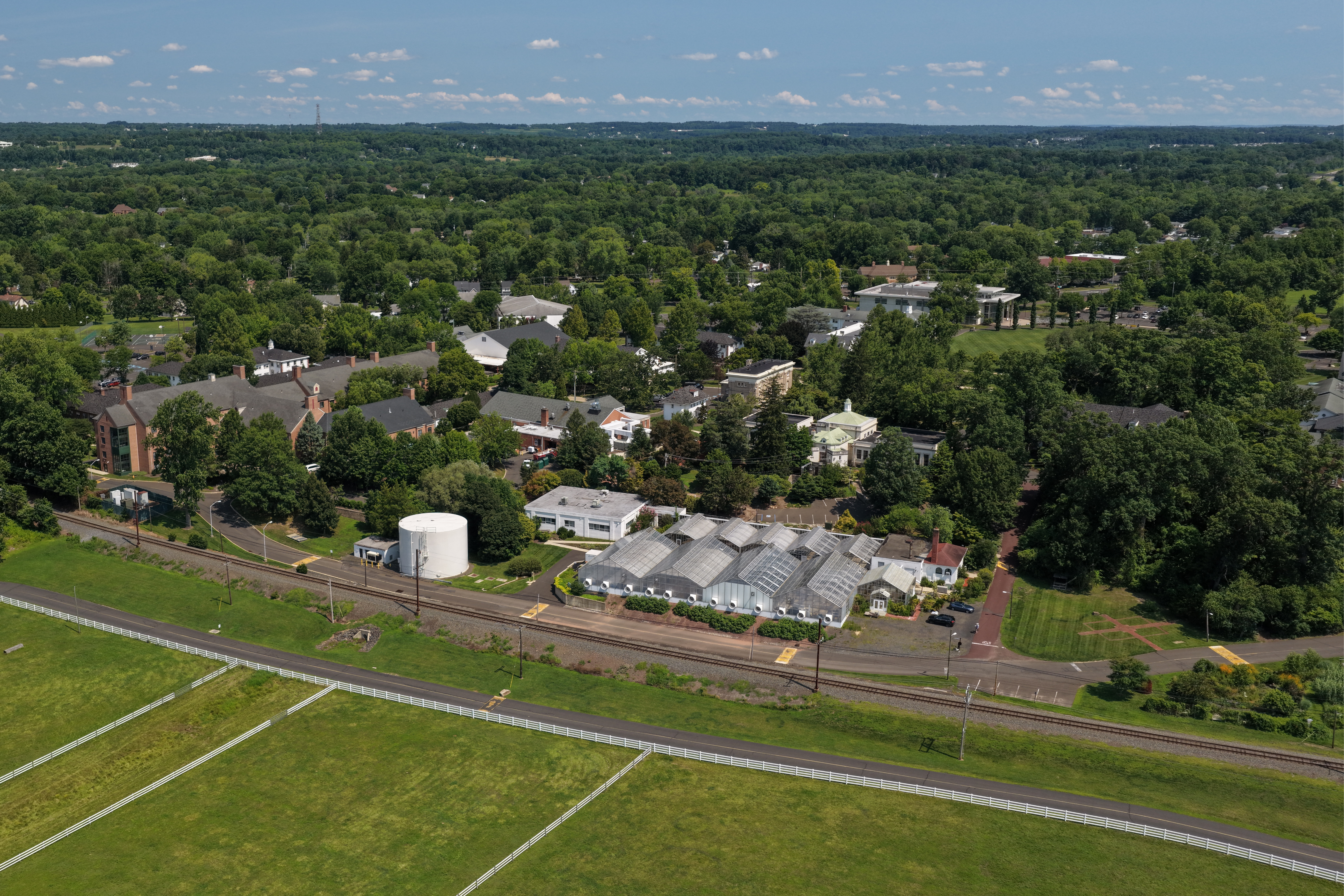 An aerial view of the greenhouses and main campus. 