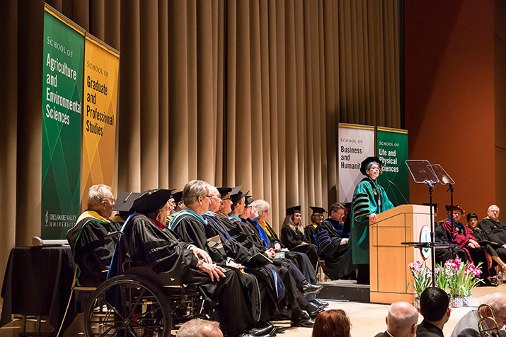 Dr. Maria Gallo with the platform party on stage