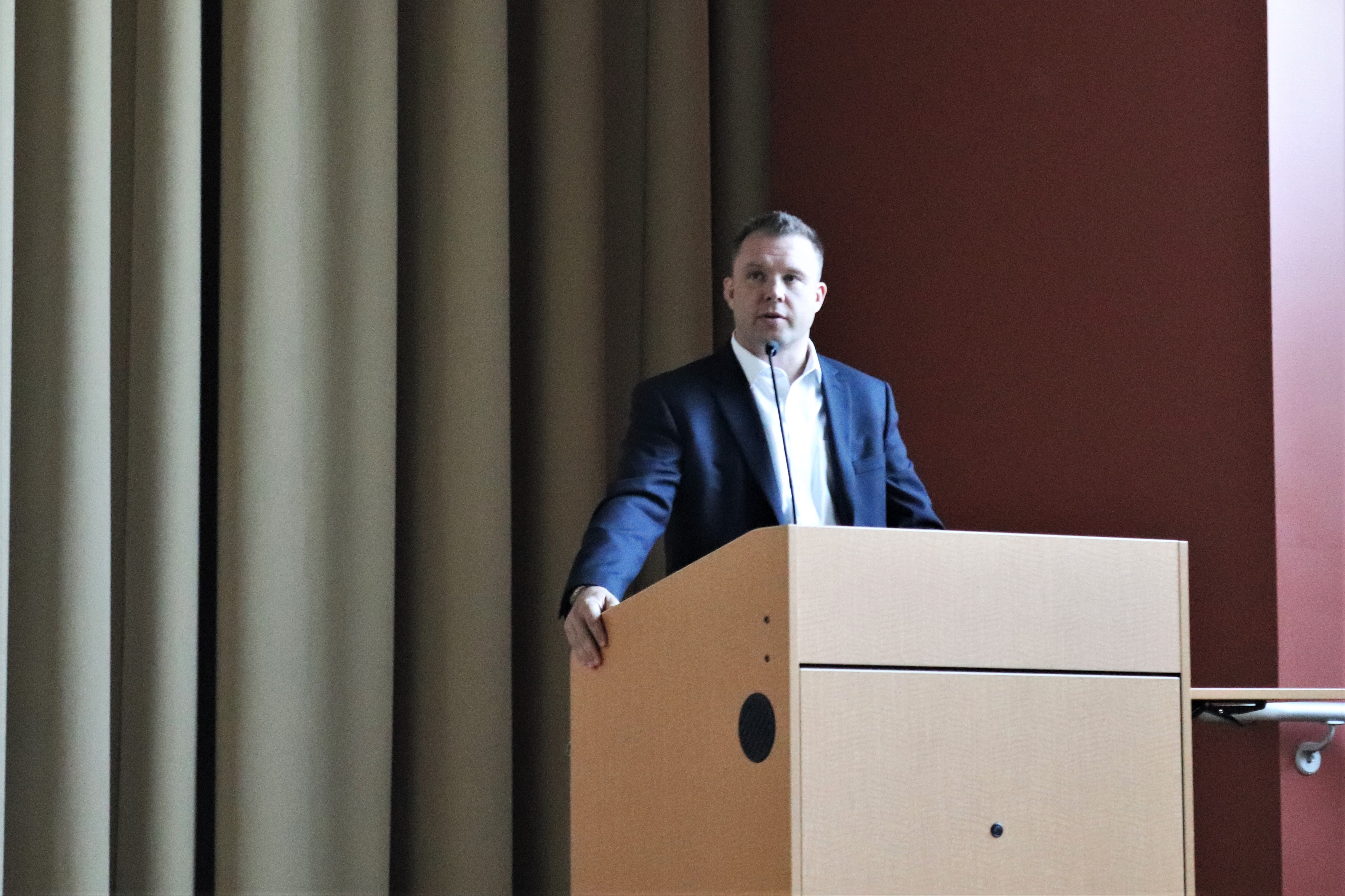 Stephen Flavel, a speaker on stage at the Watson executive in residence event