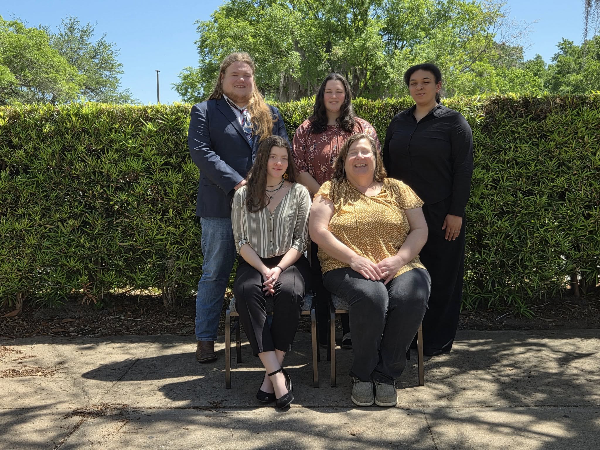 A group of people posing for a photo
AI-generated content may be incorrect.