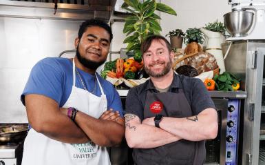 Chef Lee Chizmar and Allen Volant '25 on the set of Chef's Kitchen