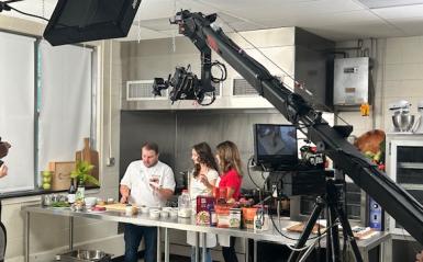 Chef Ryan Zellner with Chef's Kitchen College Campus Cooking production team on campus with Julia Fredericks