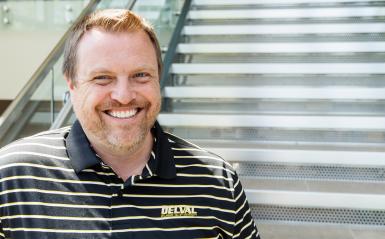 A headshot of Jeff Wehrung with a striped delval collared shirt. 