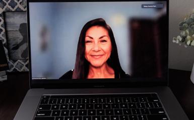 A headshot of veronica fierro taken on a laptop, fierro is a distance learning professor. 