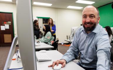 Doug McCambridge is teaching photoshop in the media lab. 
