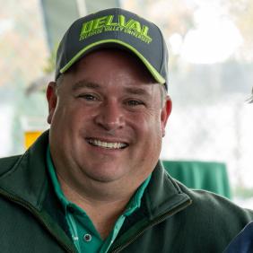 A headshot of Ben Rakus wearing DelVal gear. 