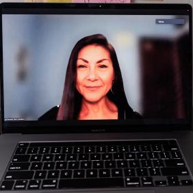 Veronica Fierro On a laptop screen, as a distance learning teacher