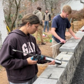Landscape design/build Students creating outdoors. 