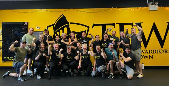 a group photo of mike's team at training for warriors