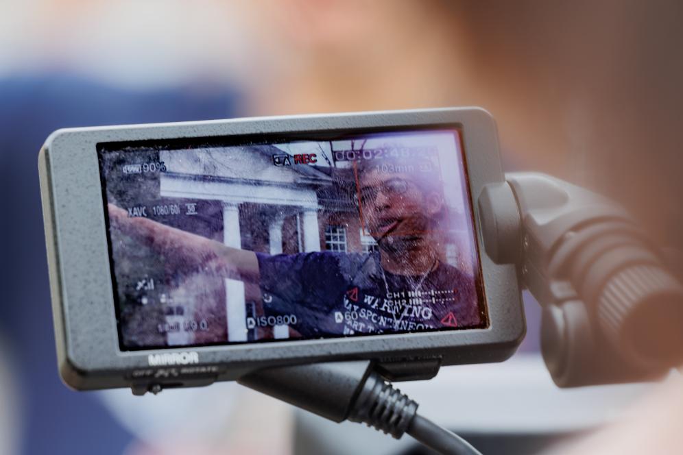 A closeup of a student holding a sony video camera.