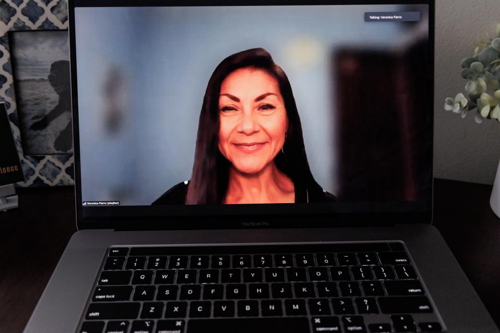 This is a photo of a computer with Veronica on Zoom. 