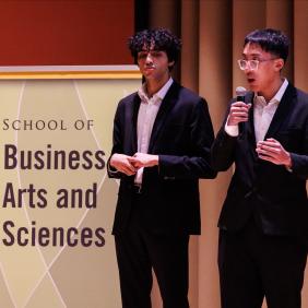 Spark bowl contestants on stage presenting their business. 