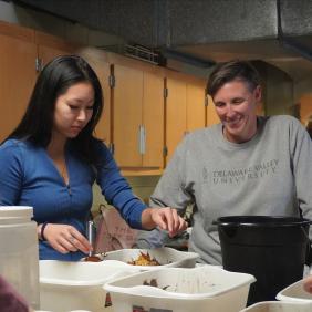 Emily Basile, biology professor, is working with a student in the wet lab. 