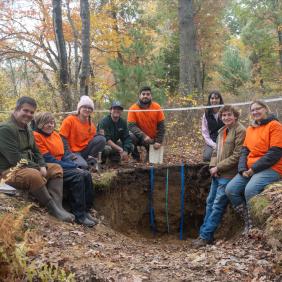 A soil judging team is working in the field. 