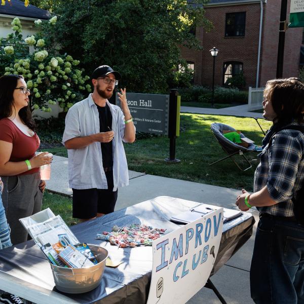 Improv students at the Clubs and Organizations Expo, meeting potential members. 