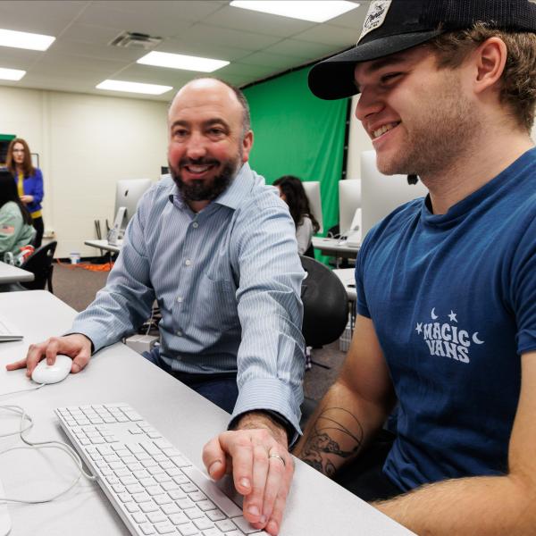 Doug McCambridge is teaching photoshop in the media lab. 