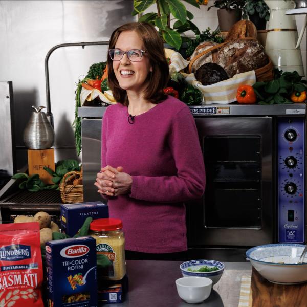 Laura Herbst is talking to a camera while in the food lab. 