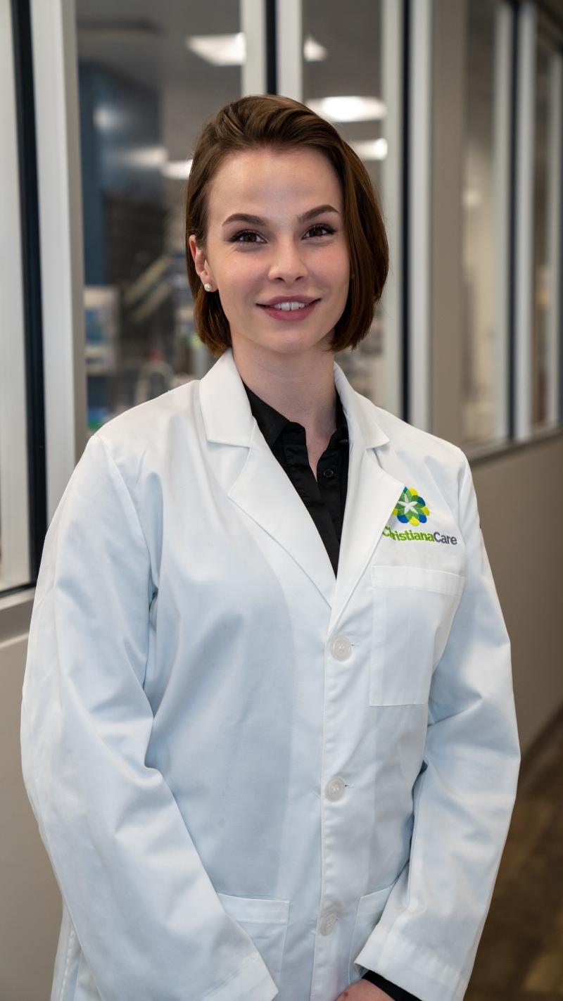 Headshot of Emily Gielda in a doctors White Coat 