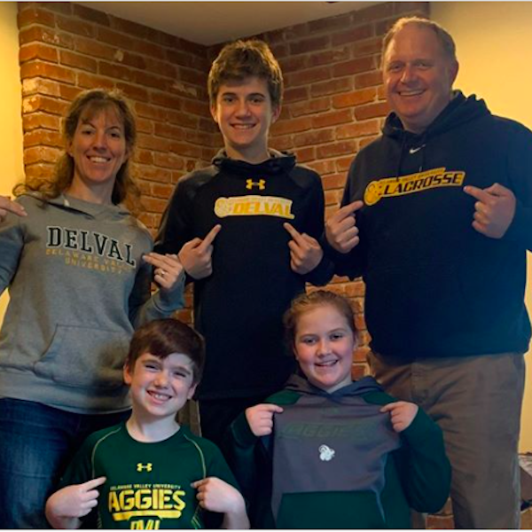 Stephanie '99 and Patrick Callahan '99 having DelVal spirit day at home