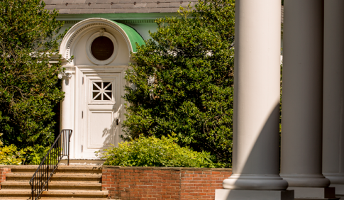 A brick building with pillars.