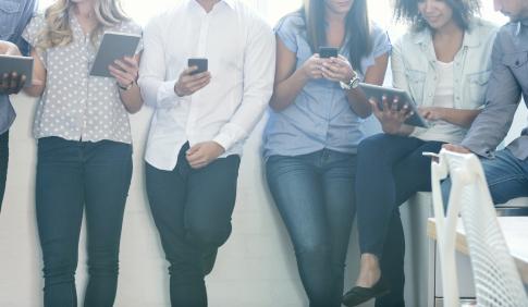 A group of students on phones and tablets