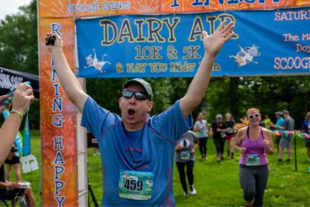 A community member is running at a marathon event on campus. 